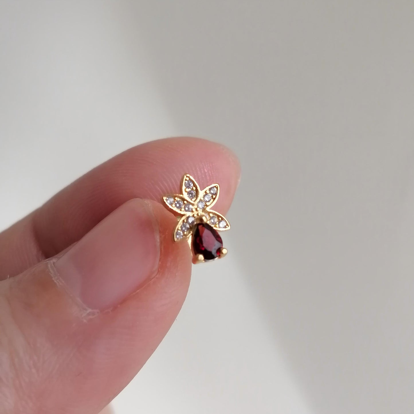 Petal Spark · Red Garnet Stud Earrings