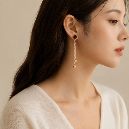 Model wearing Warm Shade smoky quartz convertible earrings with long detachable chain drops