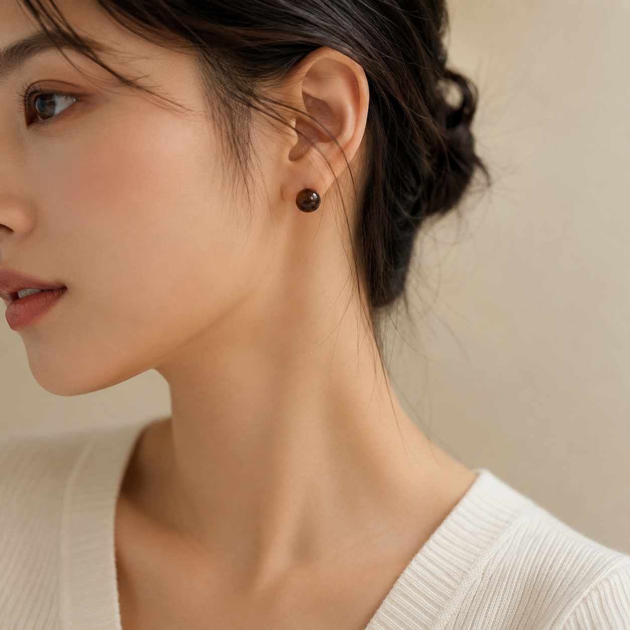 Model wearing Warm Shade smoky quartz stud earrings for a simple everyday look
