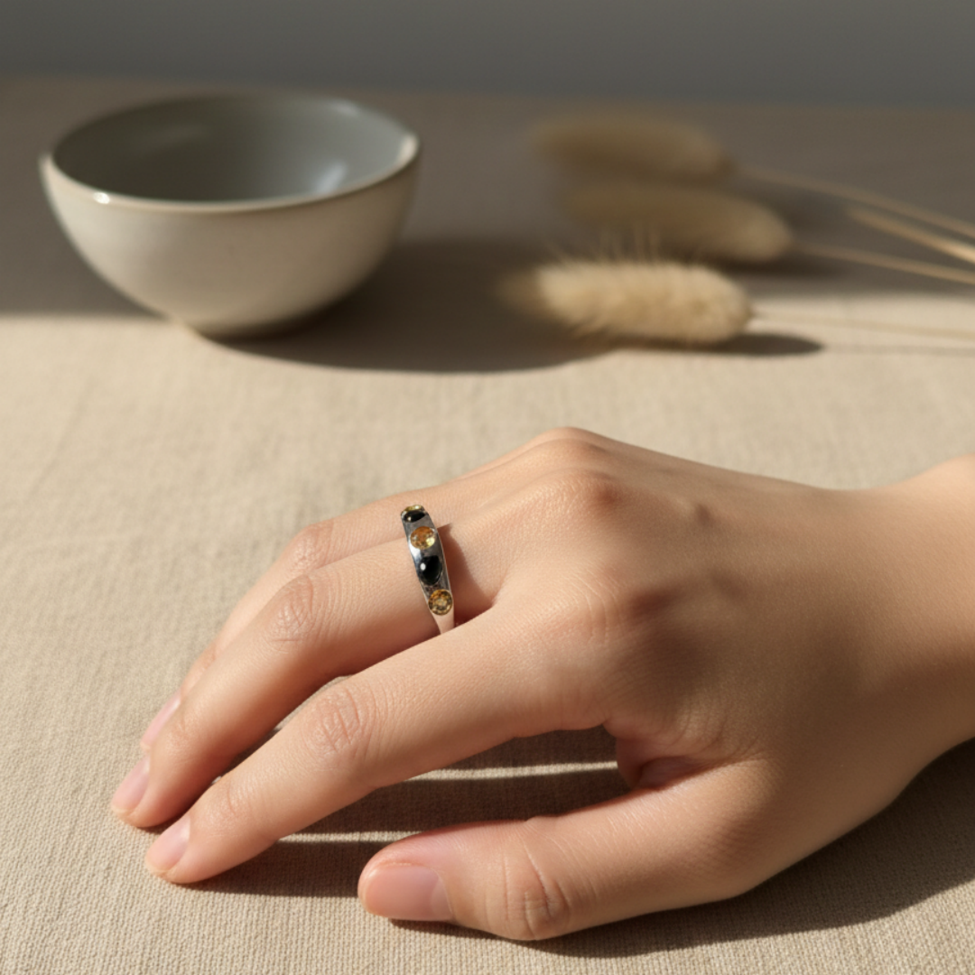 citrine-spinel ring worn on hand